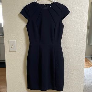 Sleek and flattering black professional dress from H&M